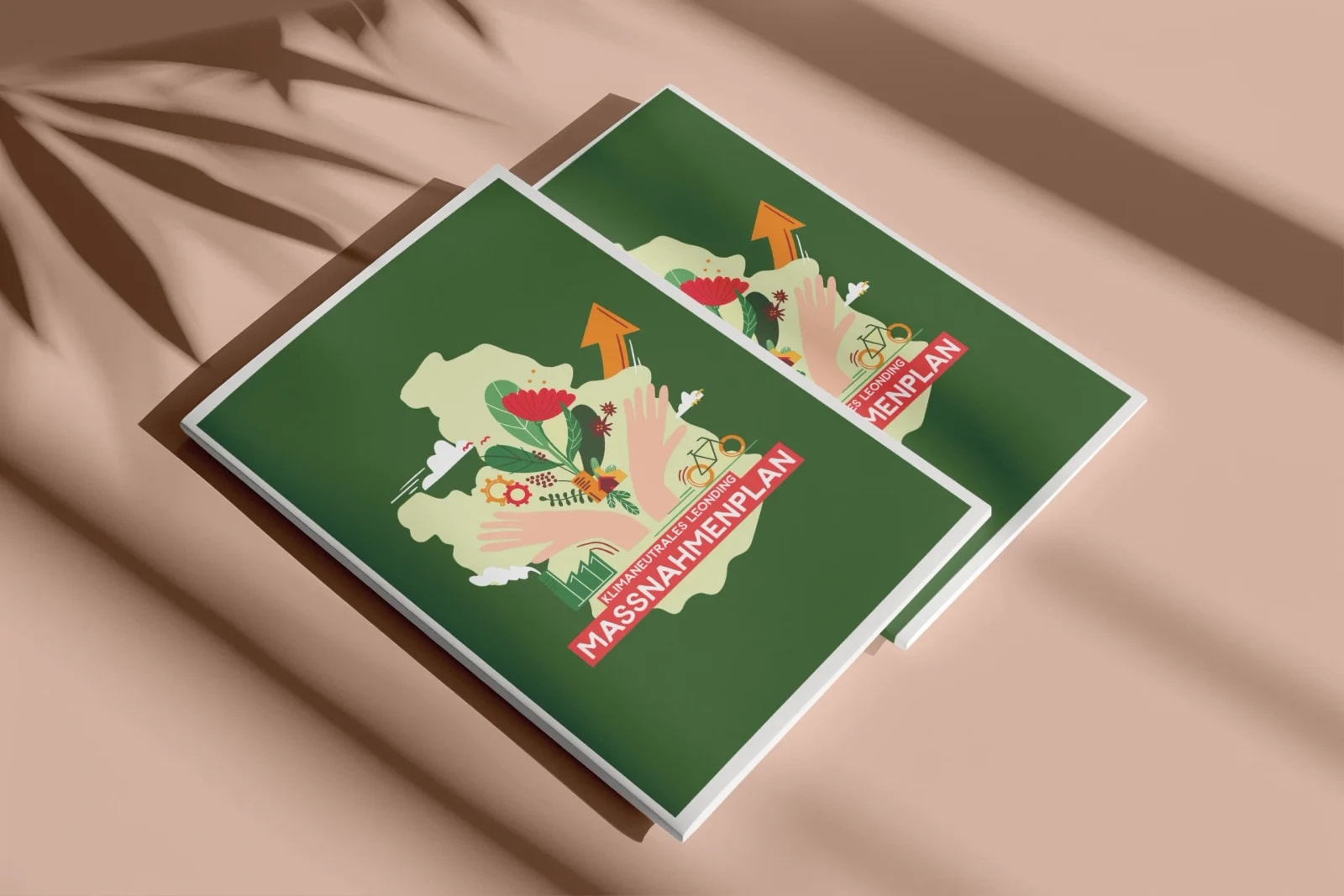 Cover „Klimaneutrales Leonding – Maßnahmenplan": grüne Broschüre mit Illustration von Händen, Blumen und Stadtsymbolen auf der Leondinger Stadtsilhouette.